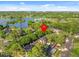 Stunning aerial view showcasing the community's proximity to a lake and recreational facilities at 1547 Farrindon Cir # 1547, Lake Mary, FL 32746
