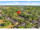 Beautiful aerial view of property surrounded by mature trees, near lake and golf course at 1547 Farrindon Cir # 1547, Lake Mary, FL 32746