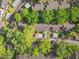 Aerial view of residential buildings nestled among mature trees, showing parking and community layout at 1547 Farrindon Cir # 1547, Lake Mary, FL 32746