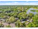 Overhead shot of lush neighborhood with lakes winding through well-maintained homes at 1547 Farrindon Cir # 1547, Lake Mary, FL 32746