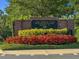 Attractive community sign for The Athletic Club at Heathrow, surrounded by vibrant flowerbeds at 1547 Farrindon Cir # 1547, Lake Mary, FL 32746