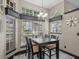 Cozy dining area with large windows providing natural light and a view of the outdoors at 1547 Farrindon Cir # 1547, Lake Mary, FL 32746