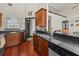 Well-equipped kitchen boasts wood cabinets, granite countertops, and seamlessly open layout at 1547 Farrindon Cir # 1547, Lake Mary, FL 32746