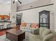 Bright living room with hardwood floors, a high ceiling and bar seating area at 1547 Farrindon Cir # 1547, Lake Mary, FL 32746