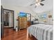 Spacious main bedroom featuring a wooden dresser, and large windows for natural light at 1547 Farrindon Cir # 1547, Lake Mary, FL 32746