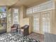 Inviting screened porch with comfortable seating, perfect for enjoying outdoor living at 1547 Farrindon Cir # 1547, Lake Mary, FL 32746