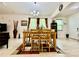 Cozy dining room with a wooden table, chandelier, and coordinated decor at 1573 Amber Leaf Cir, Ocoee, FL 34761