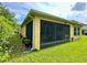 Exterior view of the home featuring a screened lanai and well-maintained landscaping at 1573 Amber Leaf Cir, Ocoee, FL 34761