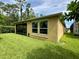 Exterior showcases a well-manicured lawn and a screened-in porch for outdoor enjoyment at 1573 Amber Leaf Cir, Ocoee, FL 34761