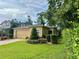 Beautiful home with manicured landscaping and a brick driveway at 1573 Amber Leaf Cir, Ocoee, FL 34761