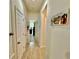Hallway with neutral colors leading to rooms at 1573 Amber Leaf Cir, Ocoee, FL 34761