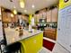 Well-lit kitchen featuring a large island, ample storage, and modern appliances at 1573 Amber Leaf Cir, Ocoee, FL 34761
