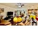 Open-concept living room with stylish furnishings and views of the kitchen and dining area at 1573 Amber Leaf Cir, Ocoee, FL 34761