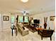 A beautifully decorated living room with neutral tones, stylish furniture, and natural light at 1573 Amber Leaf Cir, Ocoee, FL 34761