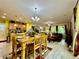 Spacious open concept, with a dining table, kitchen and living room at 1573 Amber Leaf Cir, Ocoee, FL 34761