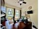 Spacious office features wood desk, large window, and natural light at 1573 Amber Leaf Cir, Ocoee, FL 34761