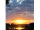 Sunset view over the lake, enhancing the community's natural beauty at 1573 Amber Leaf Cir, Ocoee, FL 34761