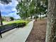 Scenic walking path lined with mature trees and lush landscaping at 1573 Amber Leaf Cir, Ocoee, FL 34761