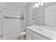 Modern bathroom with a shower-tub combo, white vanity, and white cabinets at 19105 Planetree St, Orlando, FL 32827