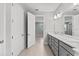 Bathroom with dual sinks, modern fixtures, and a view to the other room at 19105 Planetree St, Orlando, FL 32827