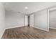 Bedroom featuring wood-look floors, neutral walls and an open door at 19105 Planetree St, Orlando, FL 32827