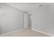 Neutral bedroom with light wood look floors, and an open door at 19105 Planetree St, Orlando, FL 32827