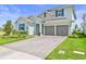 Attractive two-story home with well-kept lawn, neutral shutters, and spacious garage at 19105 Planetree St, Orlando, FL 32827