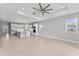 Open-concept living space with modern kitchen island and tile floors throughout at 19105 Planetree St, Orlando, FL 32827