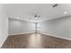 Large living room featuring two windows, recessed lights, and wood look floors at 19105 Planetree St, Orlando, FL 32827