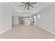 Open-concept living room with large island, stainless appliances, and modern lighting at 19105 Planetree St, Orlando, FL 32827