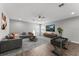 Spacious living room with modern decor, a comfortable sofa, and a foosball table at 19105 Planetree St, Orlando, FL 32827