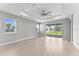 Bright and airy living room featuring tile flooring, modern fixtures, and abundant natural light at 19105 Planetree St, Orlando, FL 32827