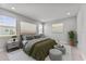 Cozy bedroom with a comfortable bed, soft lighting, and scenic window views at 19105 Planetree St, Orlando, FL 32827
