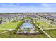Aerial view of community pool with lounge chairs and beautiful landscaping at 19105 Planetree St, Orlando, FL 32827