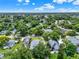 An elevated shot reveals a residential area filled with mature trees and charming single-Gathering homes at 2009 E Grant St, Orlando, FL 32806