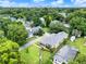 Aerial view of a home in a lush, green neighborhood with city skyline at 2009 E Grant St, Orlando, FL 32806