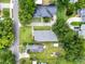 An aerial view captures the neighborhood's single-Gathering homes, tree coverage and street layouts at 2009 E Grant St, Orlando, FL 32806
