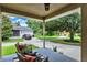 Covered front porch with seating, offering a relaxing outdoor space at 2009 E Grant St, Orlando, FL 32806