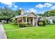 Charming single-Gathering home showcasing lush front yard and inviting curb appeal at 2009 E Grant St, Orlando, FL 32806