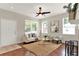 Comfortable living area with a neutral palette, ceiling fan, and cozy furnishings at 2009 E Grant St, Orlando, FL 32806