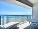 Relaxing oceanfront balcony with a lounge chair and table seating for dining at 2055 S Atlantic Ave # 505, Daytona Beach, FL 32118