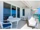 Inviting balcony with ocean views, table, and a comfortable lounge chair at 2055 S Atlantic Ave # 505, Daytona Beach, FL 32118