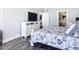 Comfortable bedroom features stylish bedding and neutral color palette at 2055 S Atlantic Ave # 505, Daytona Beach, FL 32118