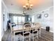 Open dining area with laminate floors, modern lighting, and ocean views at 2055 S Atlantic Ave # 505, Daytona Beach, FL 32118