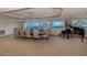 Elegant dining room with a large table, piano, and ocean views at 2055 S Atlantic Ave # 505, Daytona Beach, FL 32118
