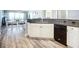 Modern kitchen featuring white cabinets, black granite countertops, and stainless steel appliances at 2055 S Atlantic Ave # 505, Daytona Beach, FL 32118