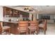 Charming kitchen featuring wood cabinetry, granite counters, and bar stool seating at 2055 S Atlantic Ave # 505, Daytona Beach, FL 32118