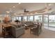 Bright living room offering couches, chairs, piano and ocean views at 2055 S Atlantic Ave # 505, Daytona Beach, FL 32118