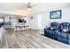 Spacious living area connects to the kitchen, perfect for entertaining, with updated flooring at 2055 S Atlantic Ave # 505, Daytona Beach, FL 32118