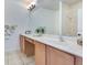Bathroom features a double vanity with great lighting and granite countertop at 20610 Maxim Pkwy, Orlando, FL 32833